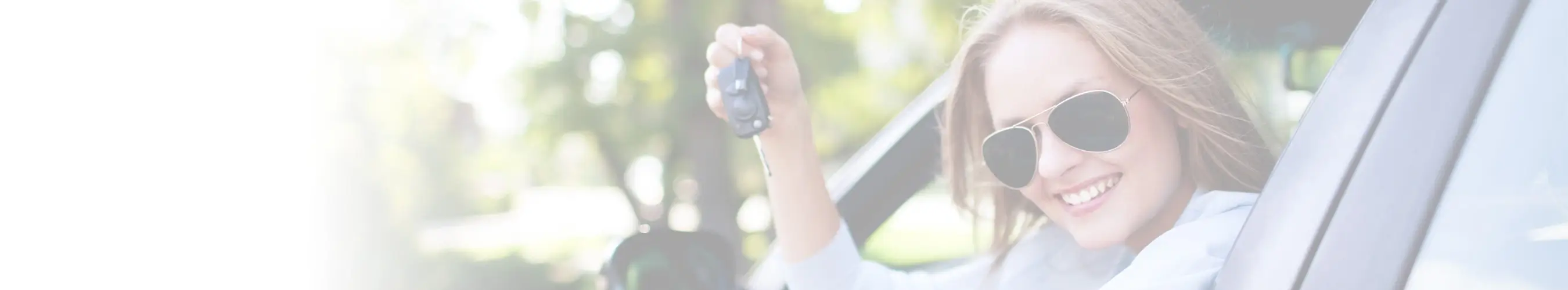 woman hanging out car window with keys