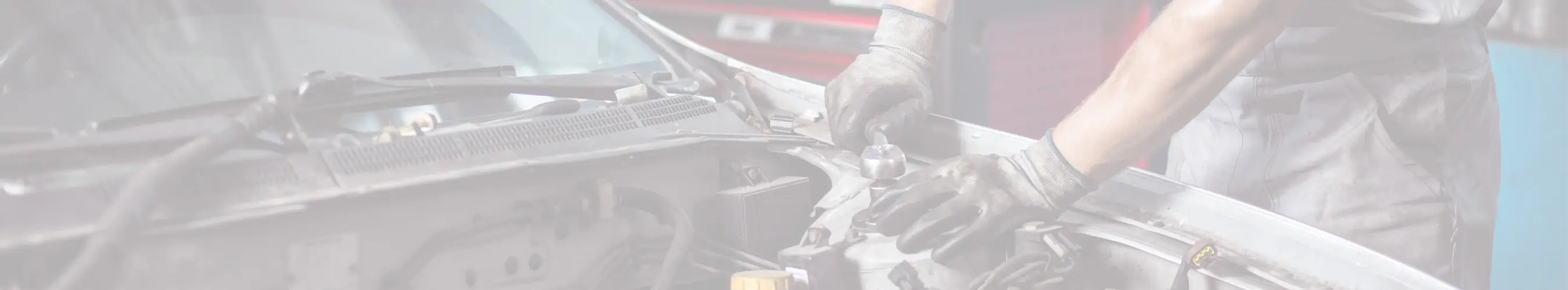 Mechanic working on vehicle engine