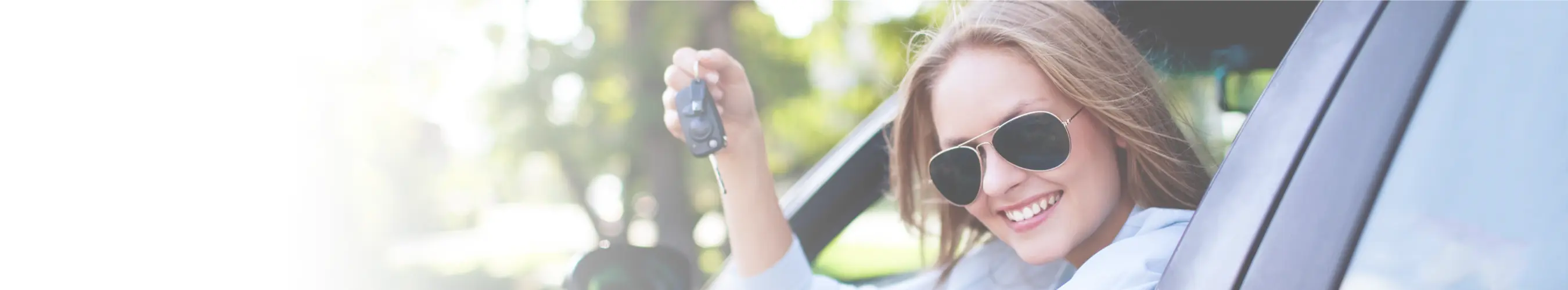 Woman driving holding keys