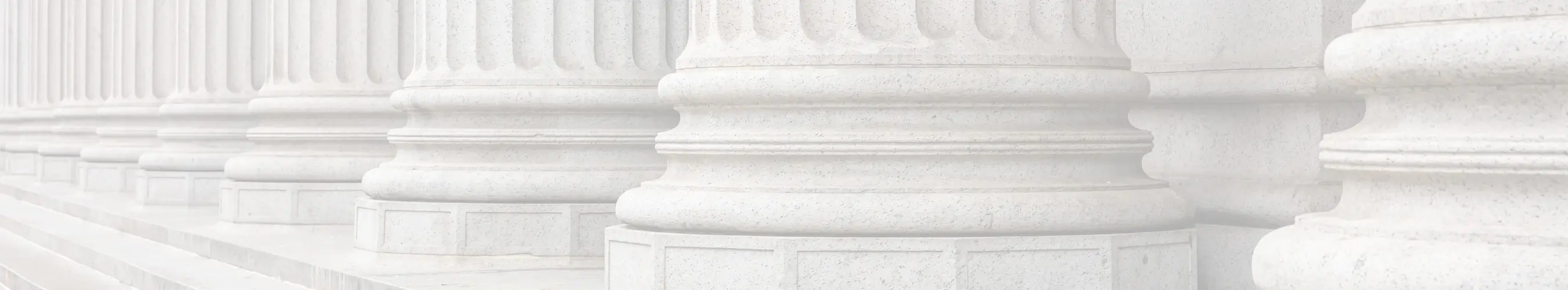Close-up view of stone pillars of a courthouse